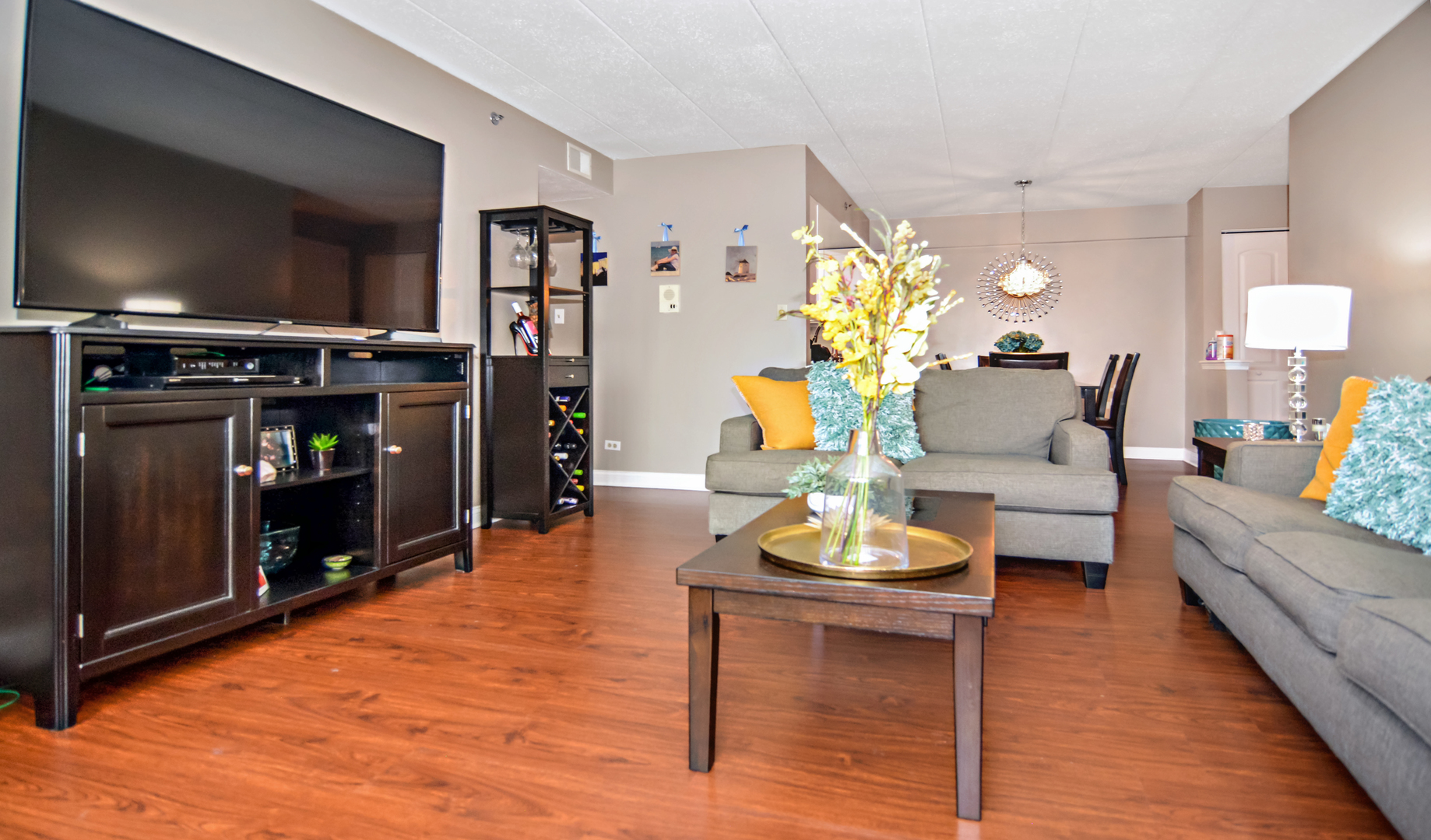 10630 Ridgeland Avenue, Unit 2A Chicago Ridge, IL 60415 - Photo 4 of 19 a living room with furniture and a flat screen tv