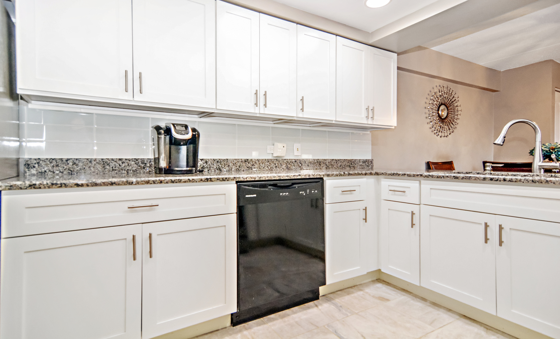 10630 Ridgeland Avenue, Unit 2A Chicago Ridge, IL 60415 - Photo 8 of 19 a kitchen with granite countertop white cabinets and white appliances
