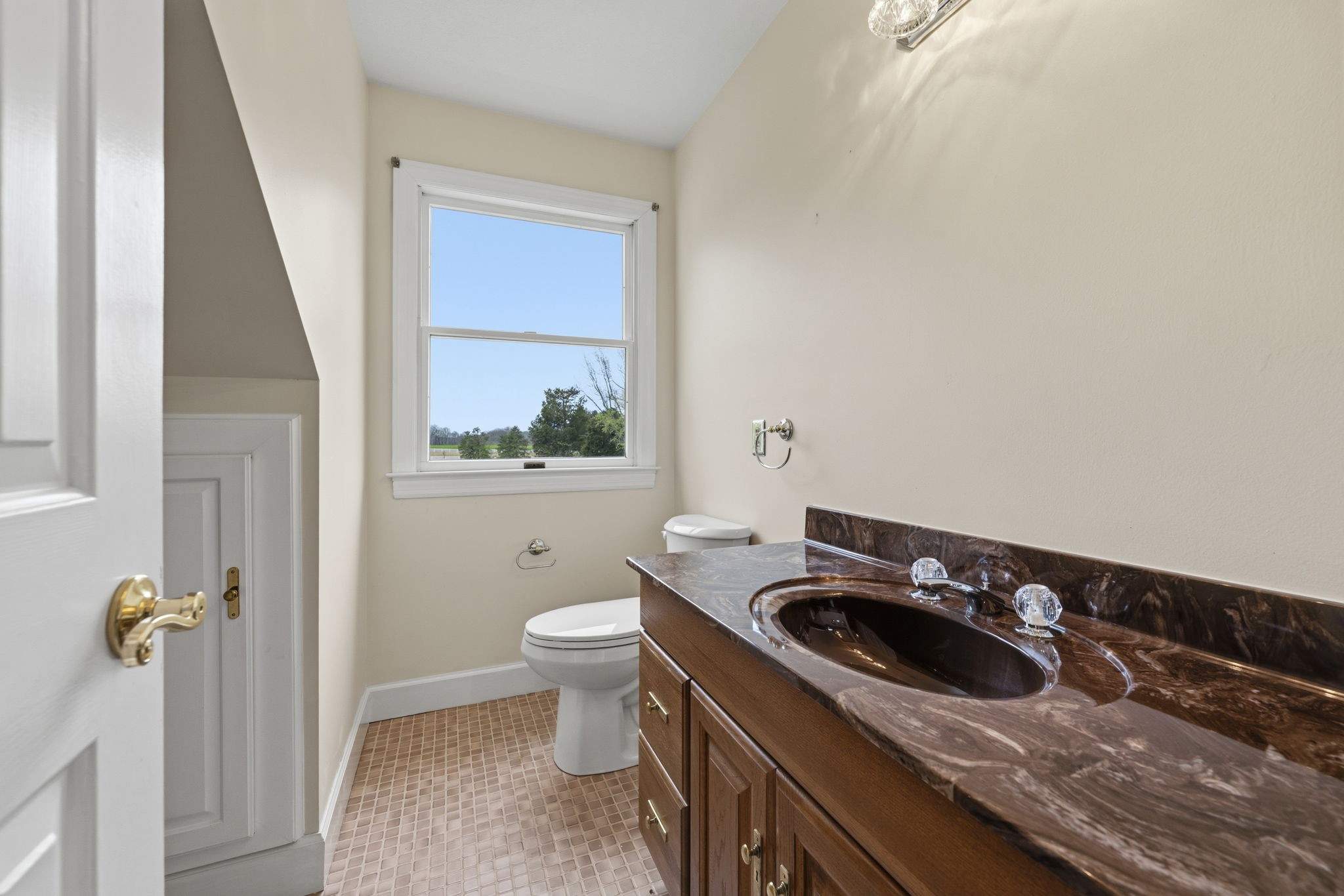 5300 Highway 31W Portland, TN 37148 - Photo 36 of 83 a bathroom with a sink a toilet and a window