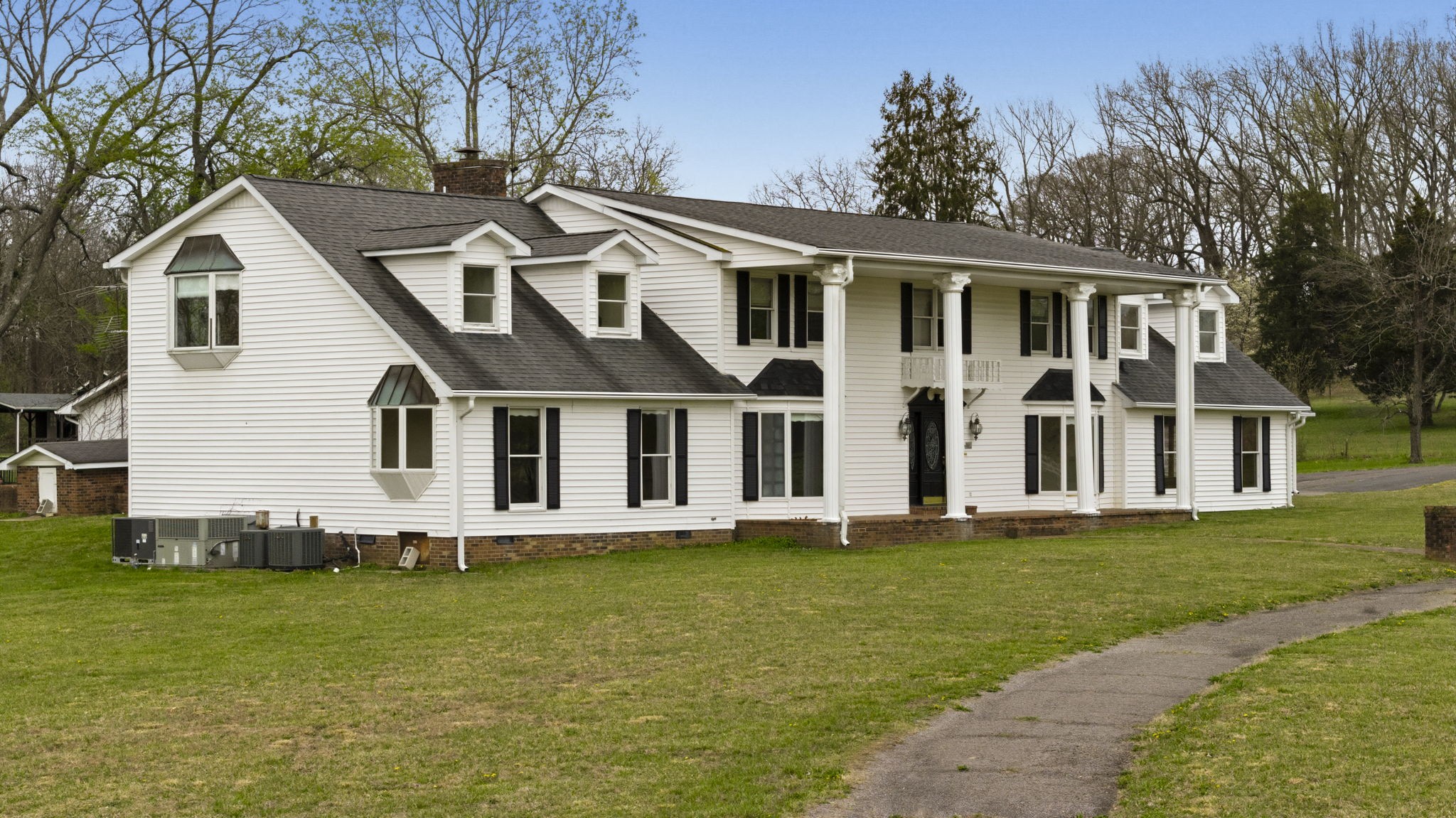 5300 Highway 31W Portland, TN 37148 - Photo 5 of 83 a front view of a house with a garden