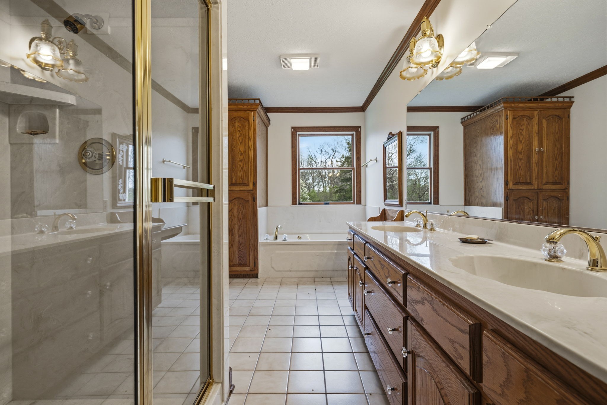5300 Highway 31W Portland, TN 37148 - Photo 61 of 83 a bathroom with a double vanity sink a mirror and a bathtub