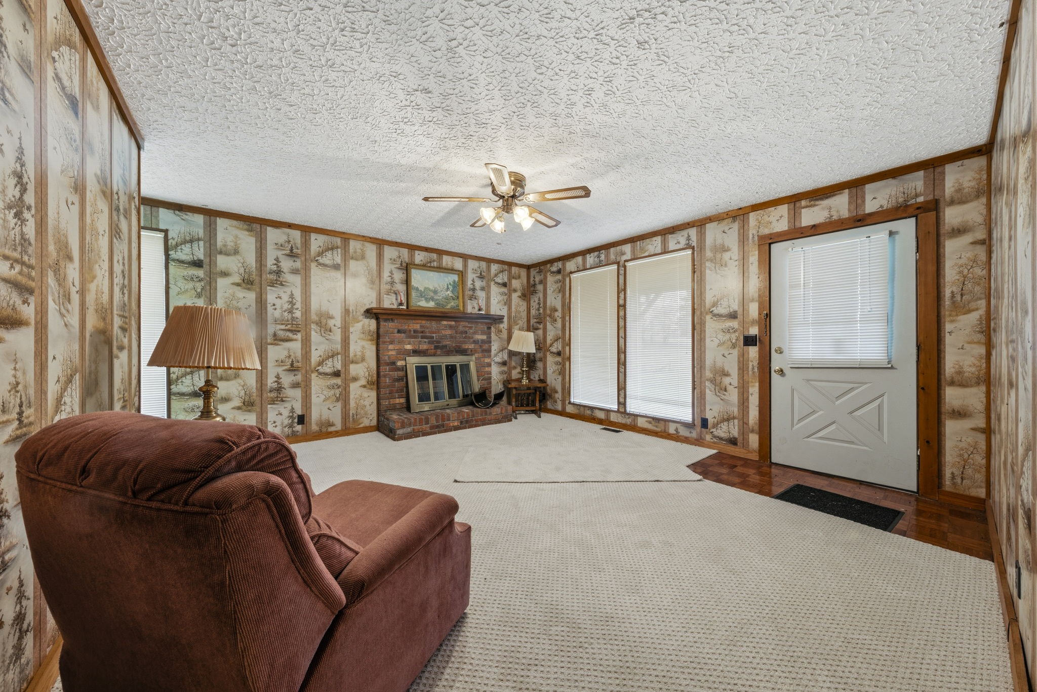 5300 Highway 31W Portland, TN 37148 - Photo 75 of 83 a living room with furniture a fireplace and a large window
