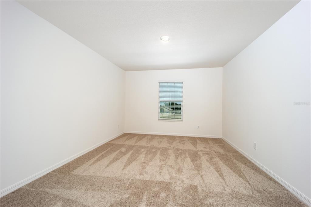 690 Poppy Lane Dundee, FL 33838 - Photo 14 of 16 an empty room with windows