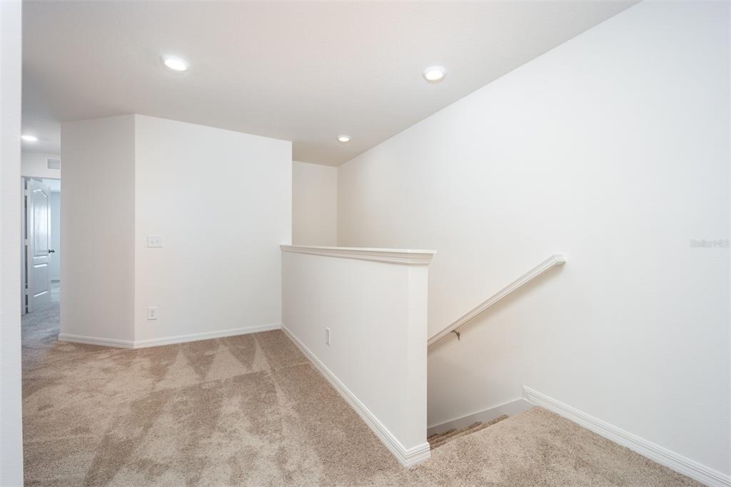 690 Poppy Lane Dundee, FL 33838 - Photo 8 of 16 a view of hallway with stairs