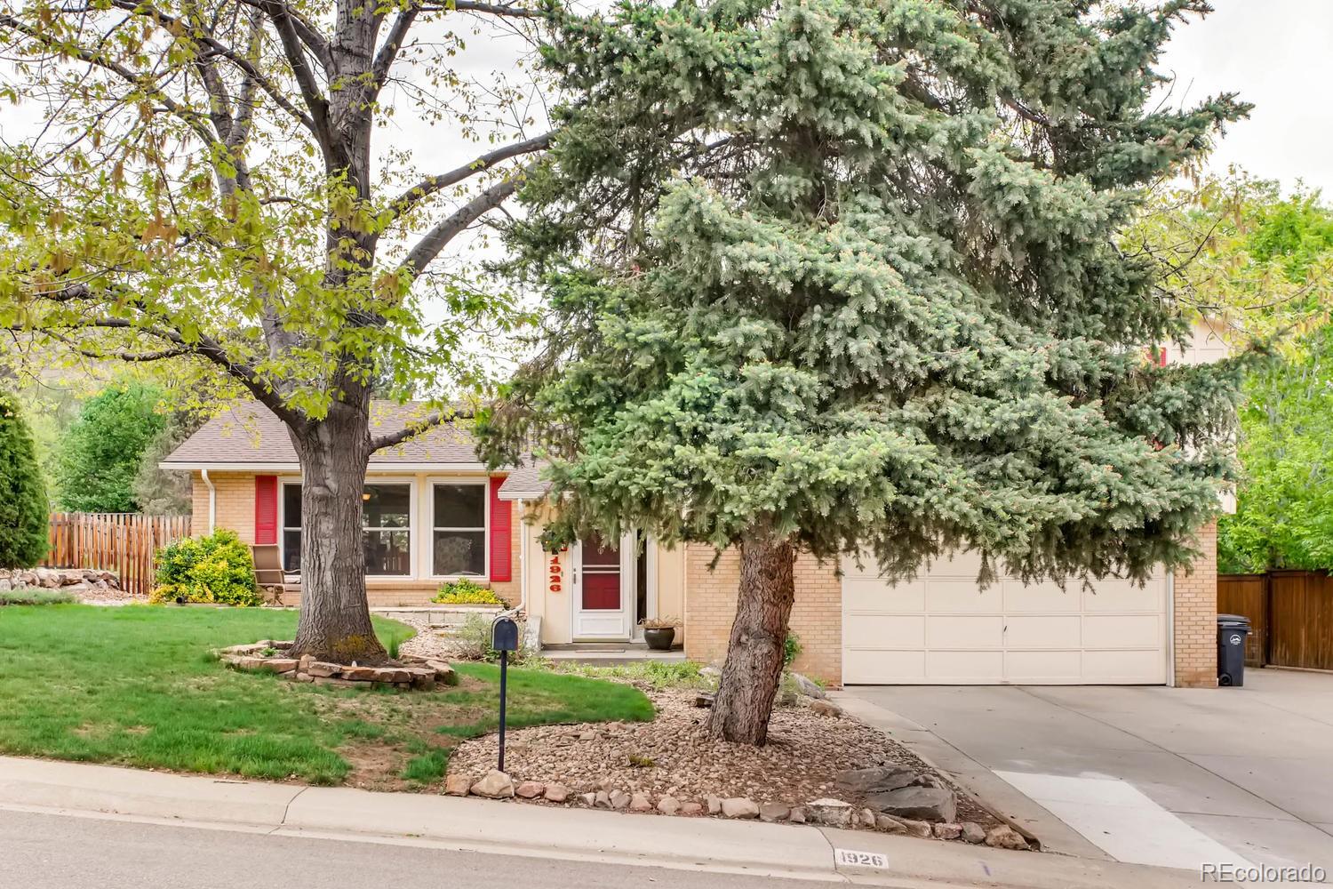 1926 Foothills Road Golden, CO 80401 - Photo 2 of 28 a front view of a house with a garden