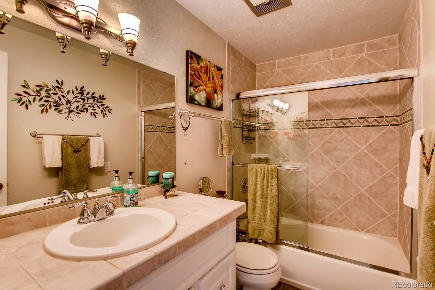 1926 Foothills Road Golden, CO 80401 - Photo 21 of 28 a bathroom with a sink toilet and shower