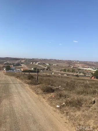 a view of a lake with houses in the background