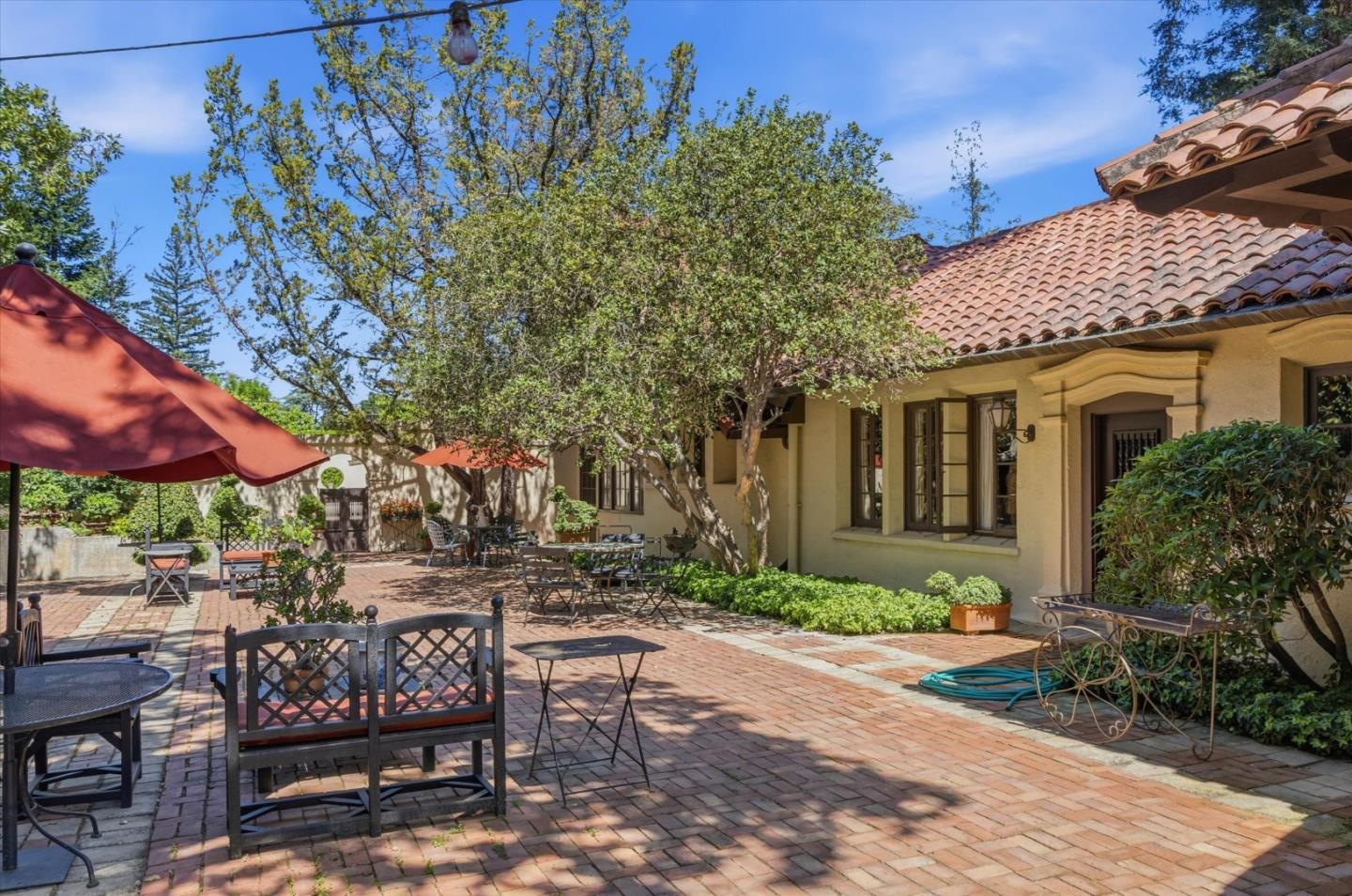18000 Overlook Road Los Gatos, CA 95030 - Photo 14 of 78 a view of patio with a table and chairs under an umbrella