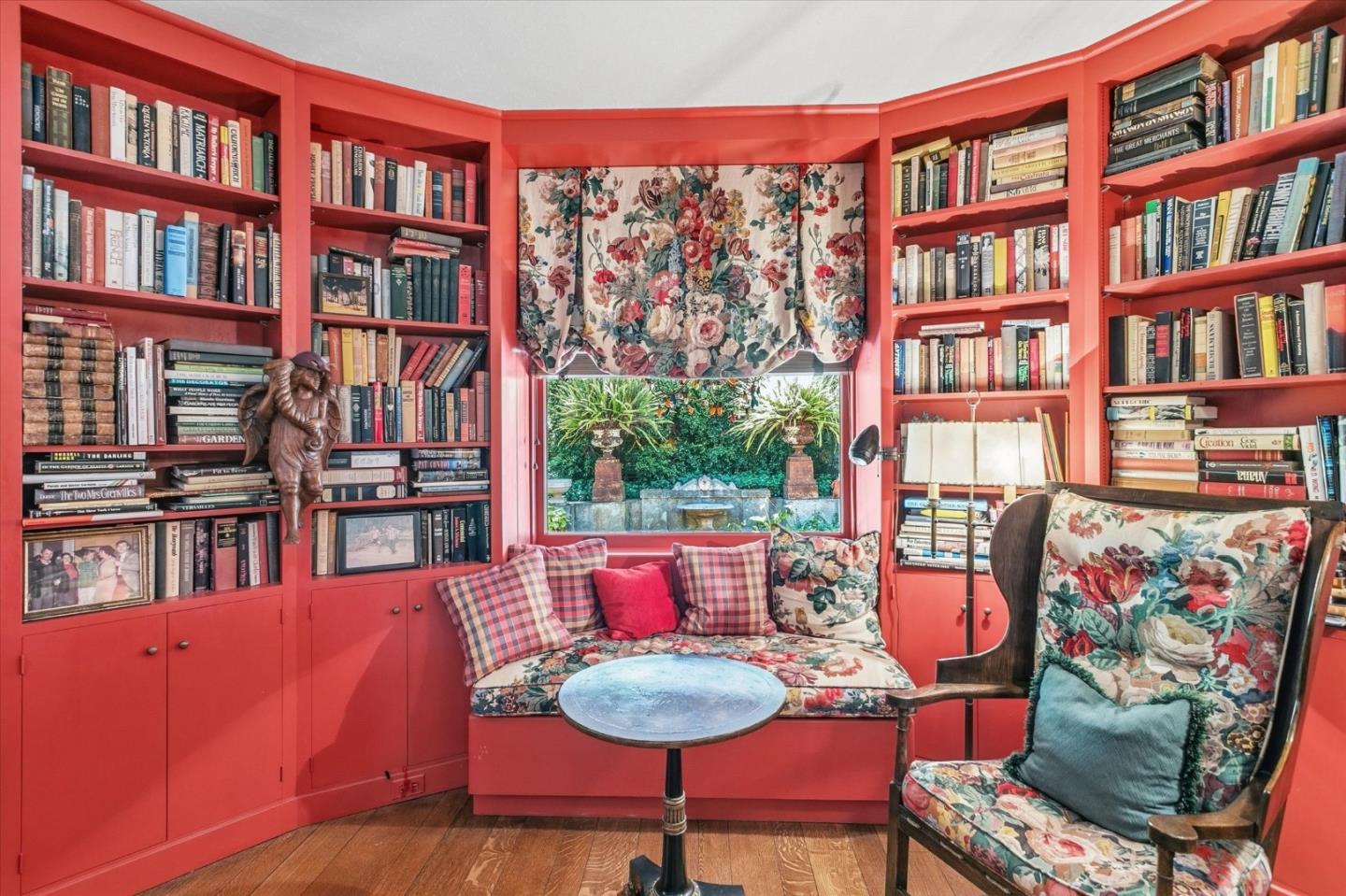 18000 Overlook Road Los Gatos, CA 95030 - Photo 31 of 78 a living room with furniture lots of books and a large window