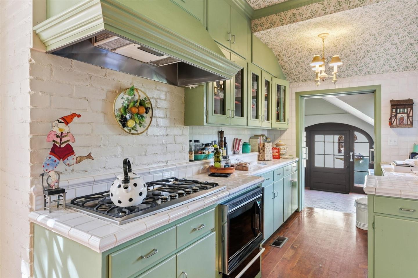 18000 Overlook Road Los Gatos, CA 95030 - Photo 48 of 78 a kitchen with stainless steel appliances granite countertop a stove a sink and a wooden cabinets