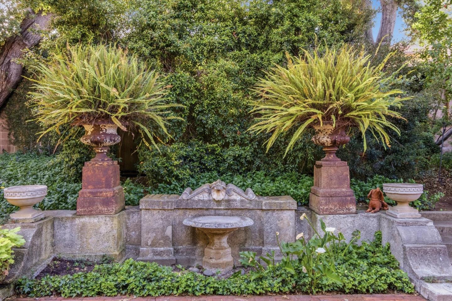 18000 Overlook Road Los Gatos, CA 95030 - Photo 49 of 78 a front view of a house with a yard and fountain