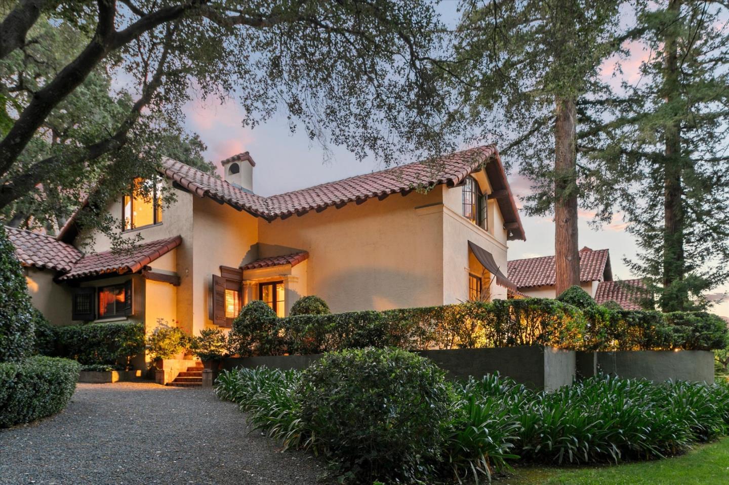 18000 Overlook Road Los Gatos, CA 95030 - Photo 5 of 78 a front view of a house with a yard and outdoor seating