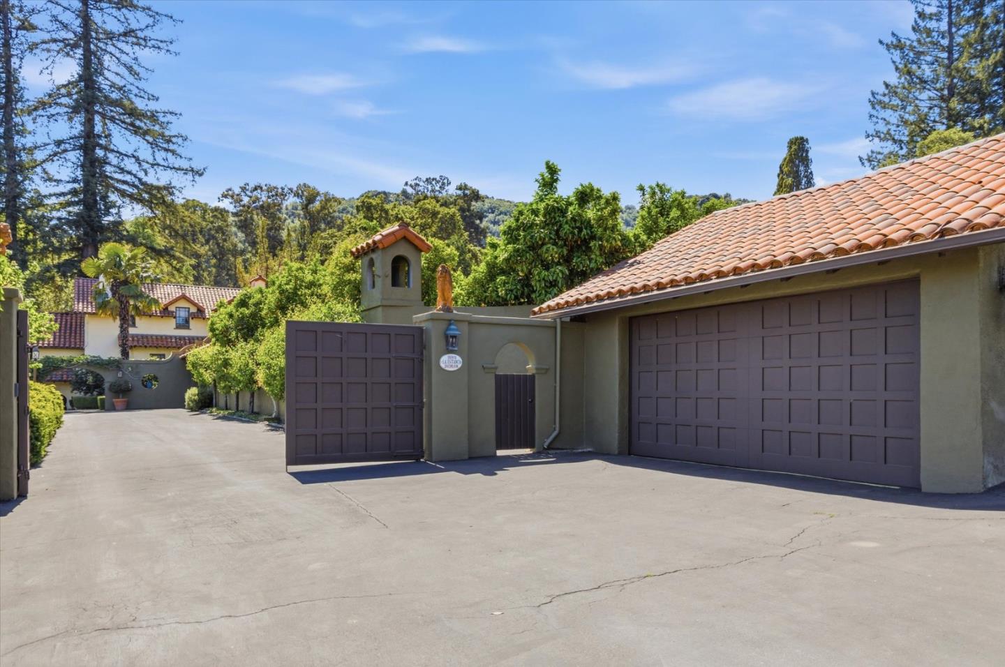 18000 Overlook Road Los Gatos, CA 95030 - Photo 7 of 78 a view of a house with a garage and yard