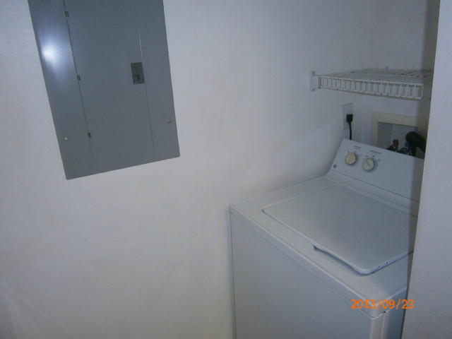 10312 Fox Trail Road South, Unit 1014 West Palm Beach, FL 33411 - Photo 7 of 12 a utility room with dryer and washer