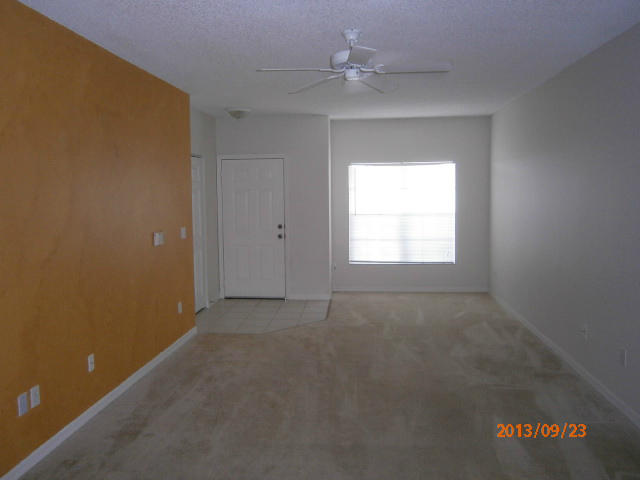 10312 Fox Trail Road South, Unit 1014 West Palm Beach, FL 33411 - Photo 9 of 12 an empty room with a window