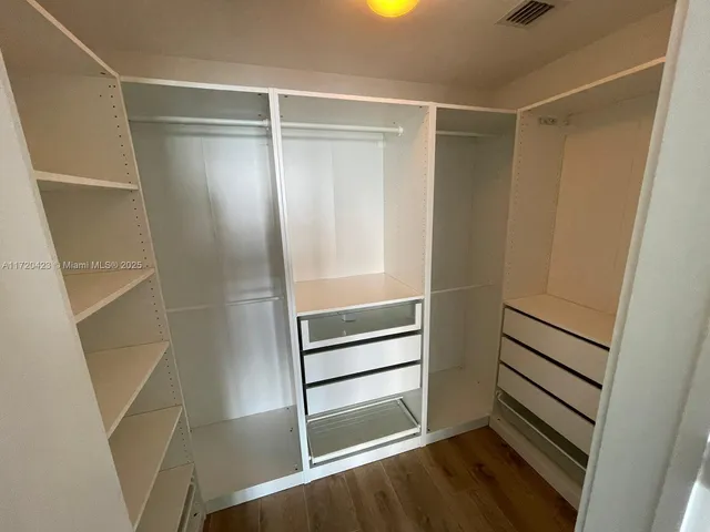 a view of an empty walk in closet