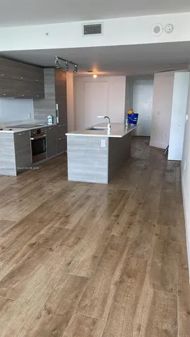 a view of a kitchen with a sink
