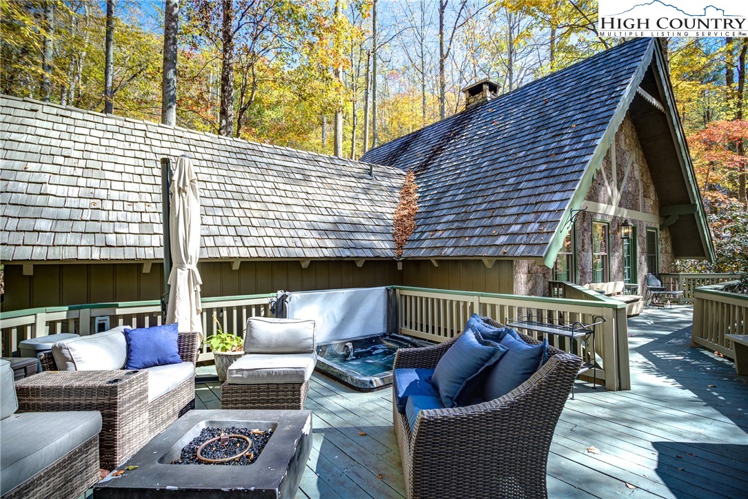 a view of a patio with couches chairs and a potted plant