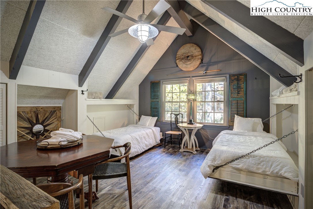 2950 Hickory Boone, NC 28607 - Photo 16 of 26 a living room with furniture a clock and a large window