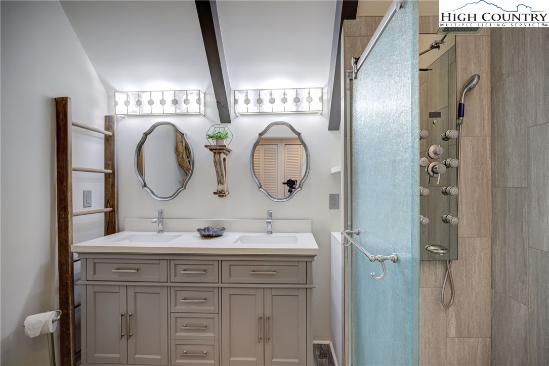 2950 Hickory Boone, NC 28607 - Photo 20 of 26 a bathroom with a sink and a mirror