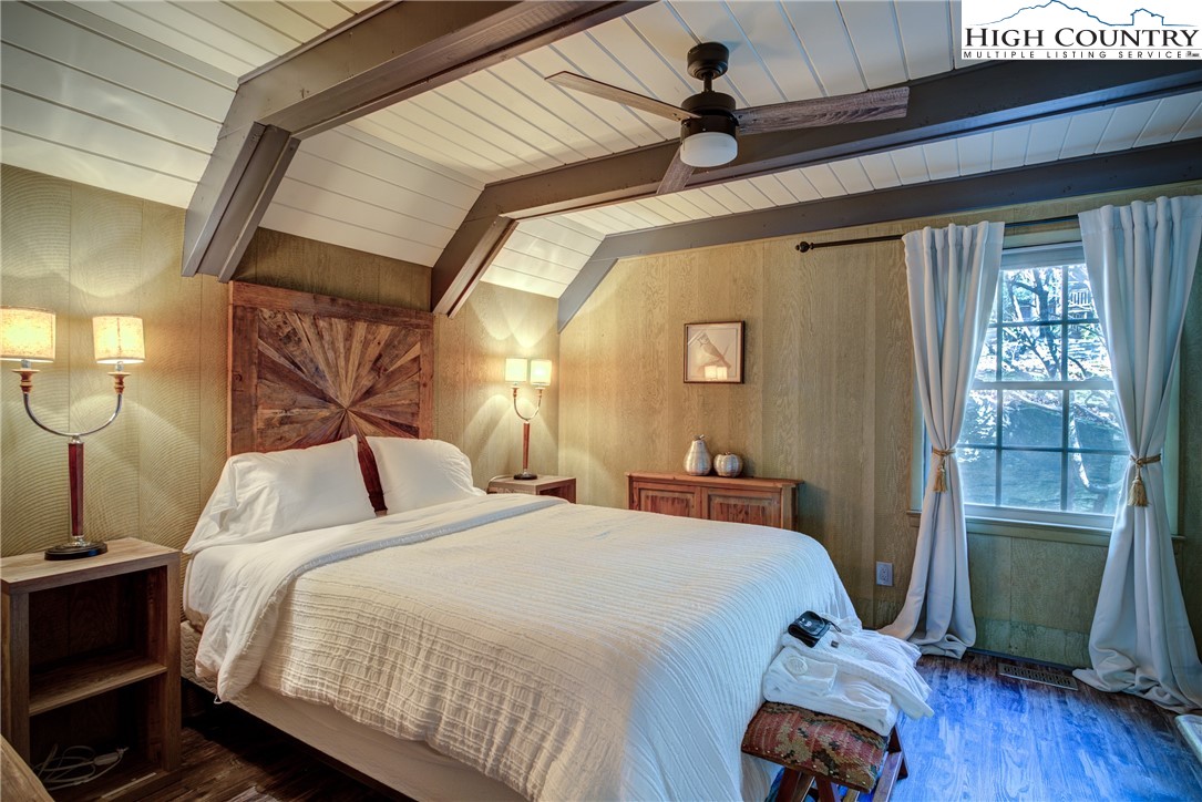 2950 Hickory Boone, NC 28607 - Photo 23 of 26 a bedroom with a bed and wooden floor