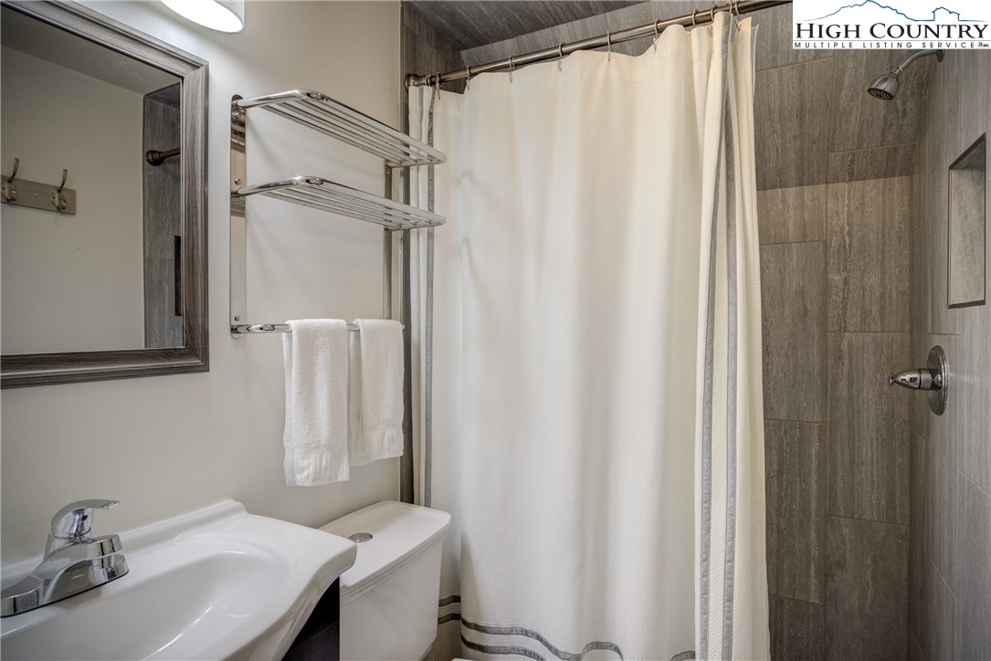 2950 Hickory Boone, NC 28607 - Photo 25 of 26 a bathroom with a sink and a mirror