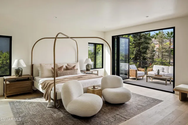 a spacious bathroom with a double vanity sink and a mirror