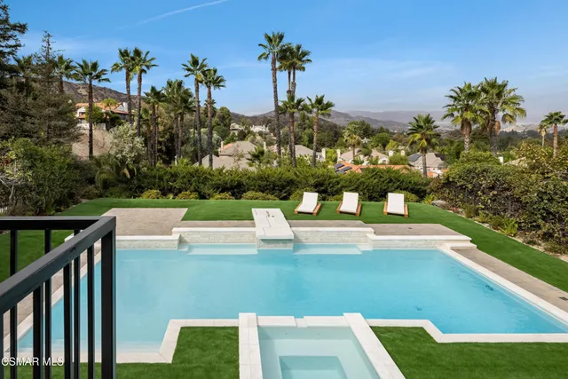 a bathroom shower with a glass shower door