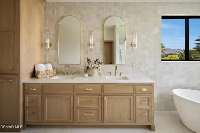 a bedroom with a bed lamp and window