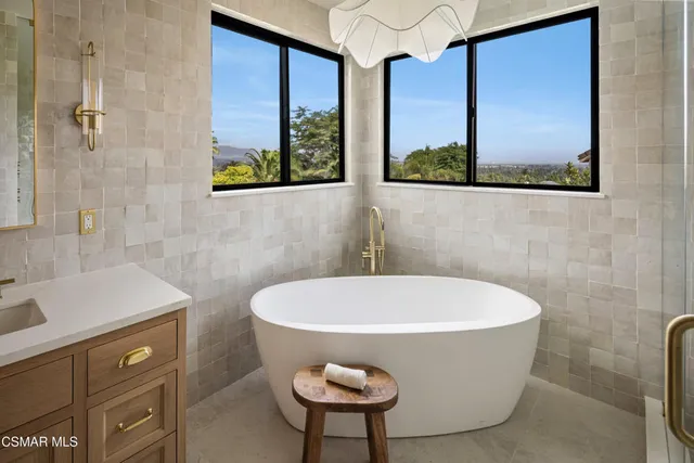 a bedroom with a bed and a dresser in it