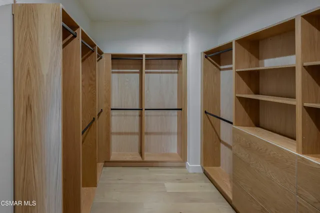 a living room with furniture and a painting