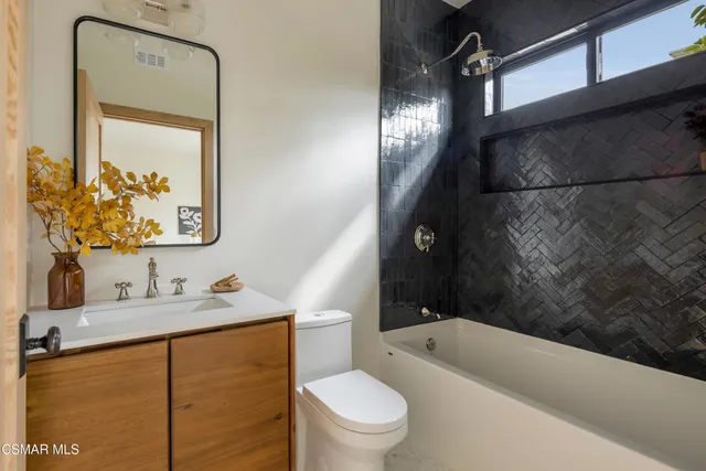 a front view of house with yard and swimming pool