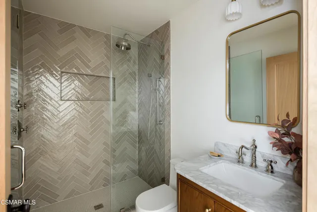 a view of a chairs and table in backyard of the house