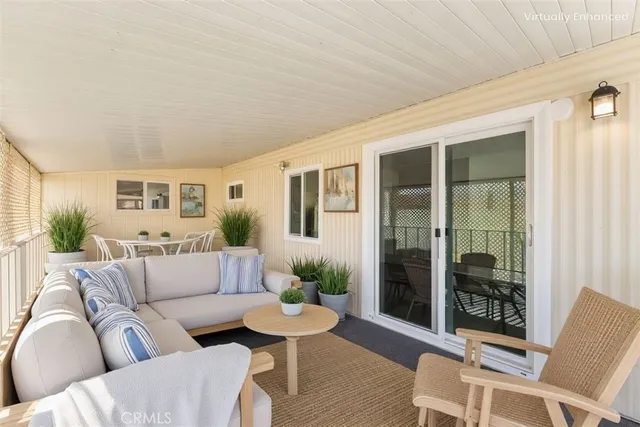 a view of a balcony with wooden floor