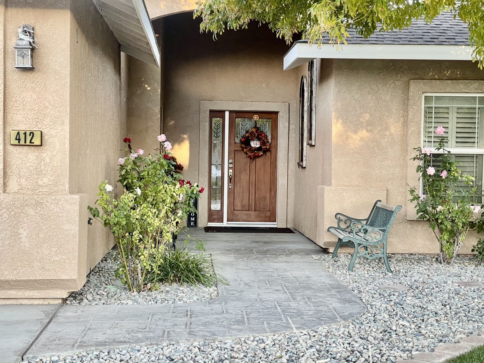 412 Acacia Street Ridgecrest, CA 93555 - Photo 27 of 31 a front view of a house with garden