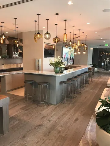 a view of bathroom with a potted plant on the counter