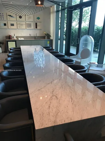 a room with gym equipment and a flat screen tv