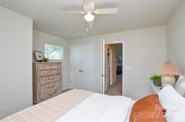 a bedroom with a bed and a dresser