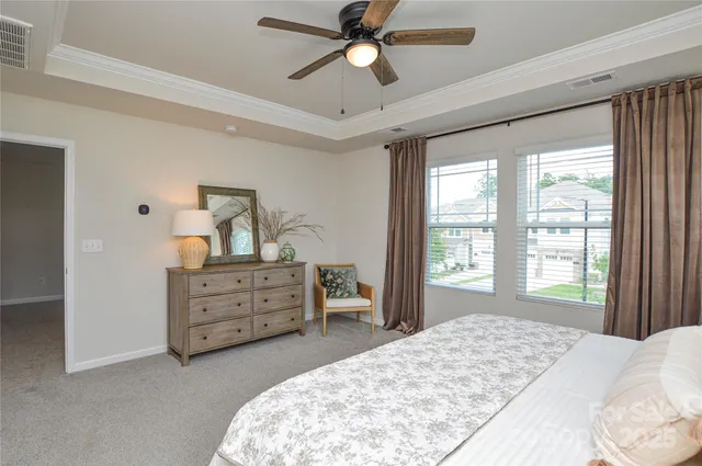 a bed room with a bed and a dresser