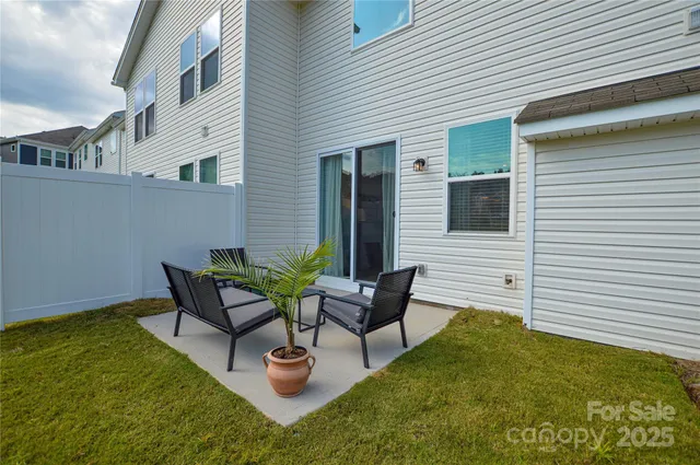 a backyard of a house with seating space
