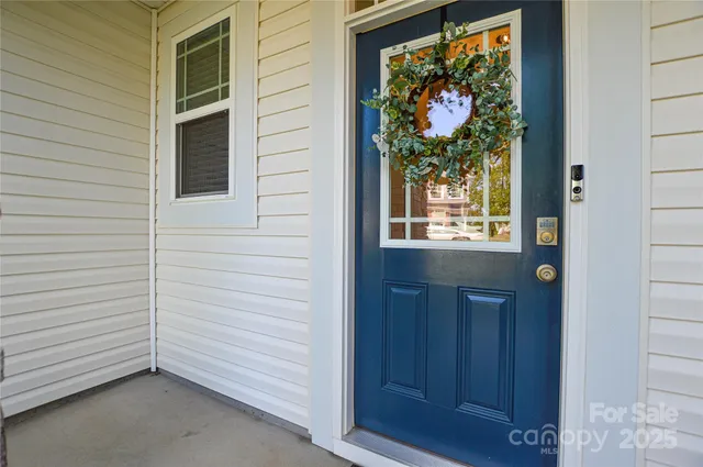a view of a door and a window of the house