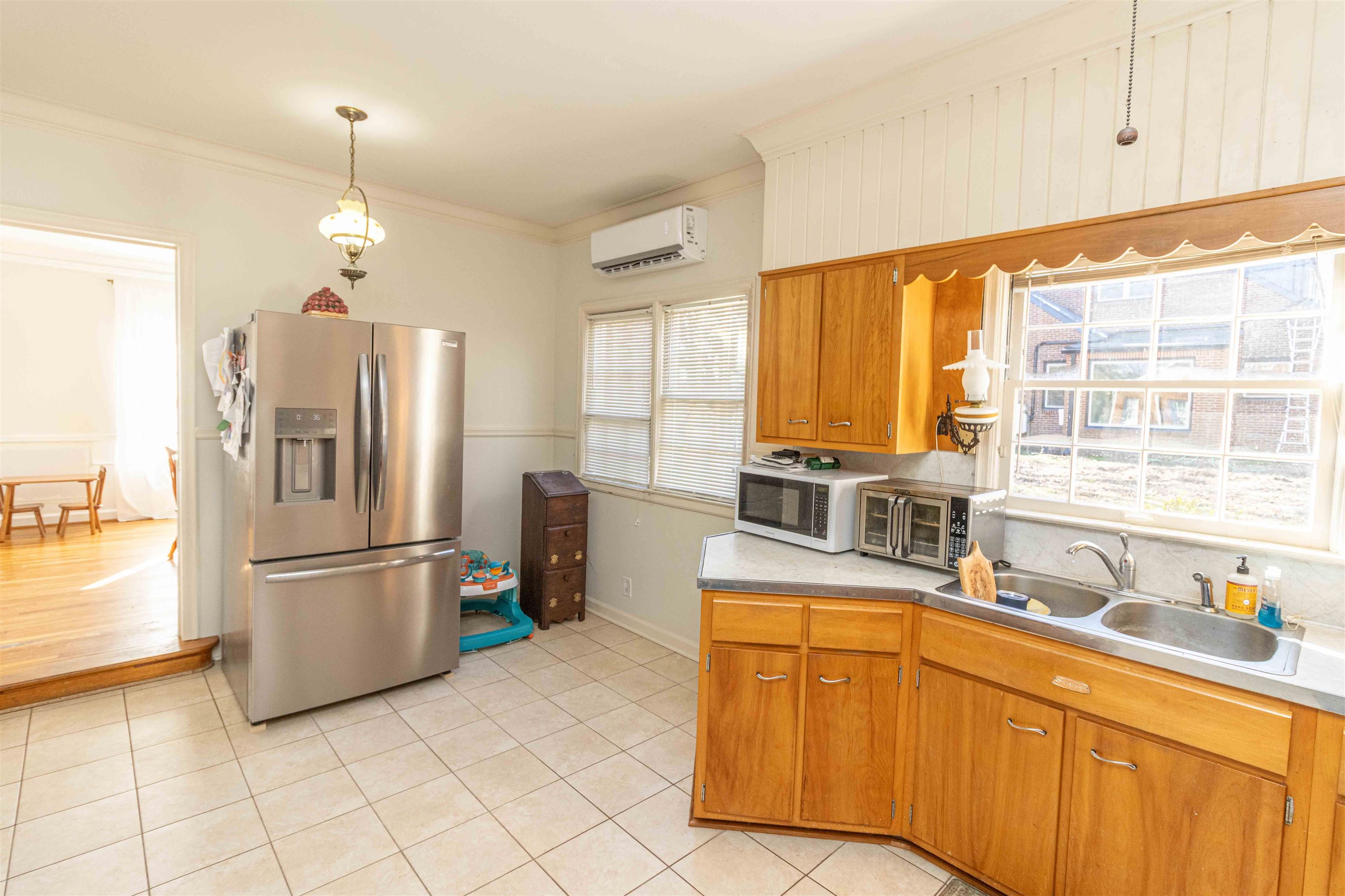 228 North 3rd Street Selmer, TN 38375 - Photo 12 of 33 a kitchen with stainless steel appliances granite countertop a refrigerator and a sink