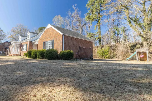 a view of a house with a small yard