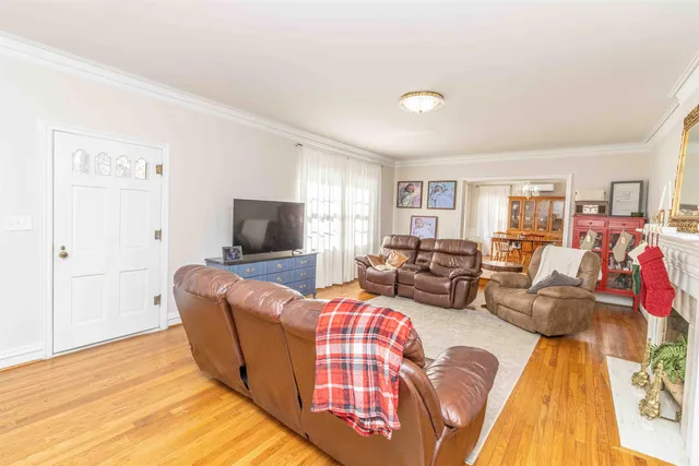 a living room with furniture or couch and a flat screen tv