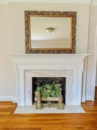 a view of fireplace with wooden floor