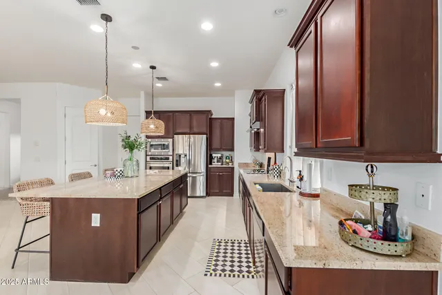 a kitchen with kitchen island granite countertop lots of counter top space
