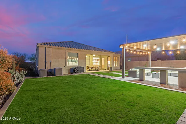 a view of an house with backyard porch and furniture