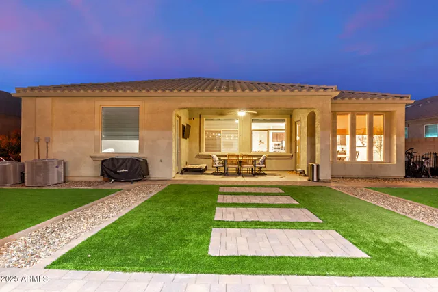 a view of a chairs and table in the patio