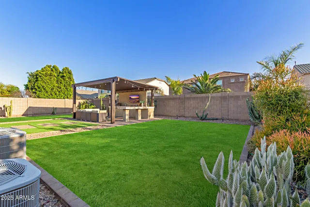 a view of a house with a yard porch and sitting area