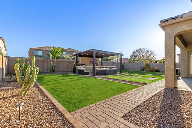 a patio view with table and chairs and potted plants